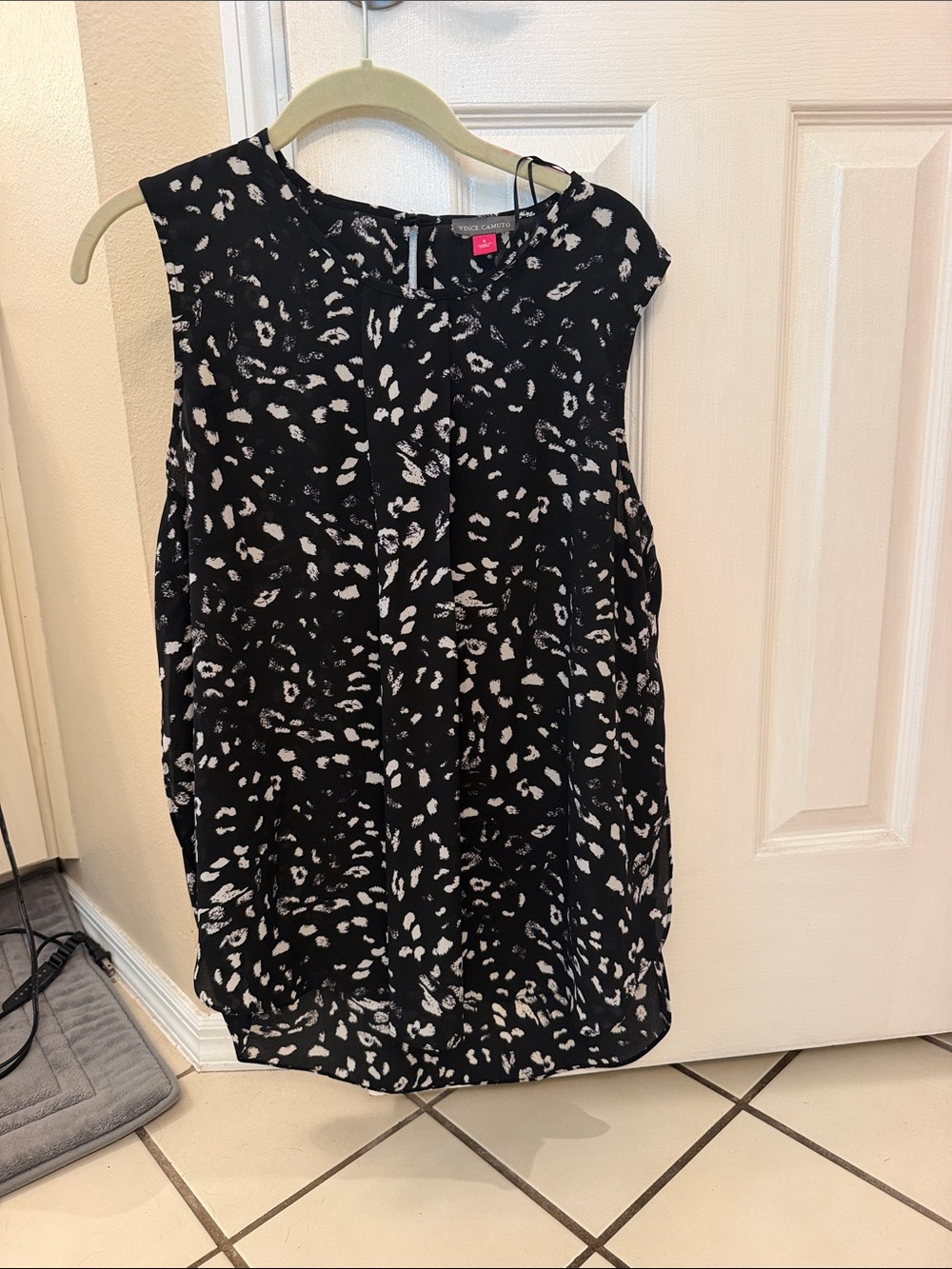 Women's sleeveless top with label